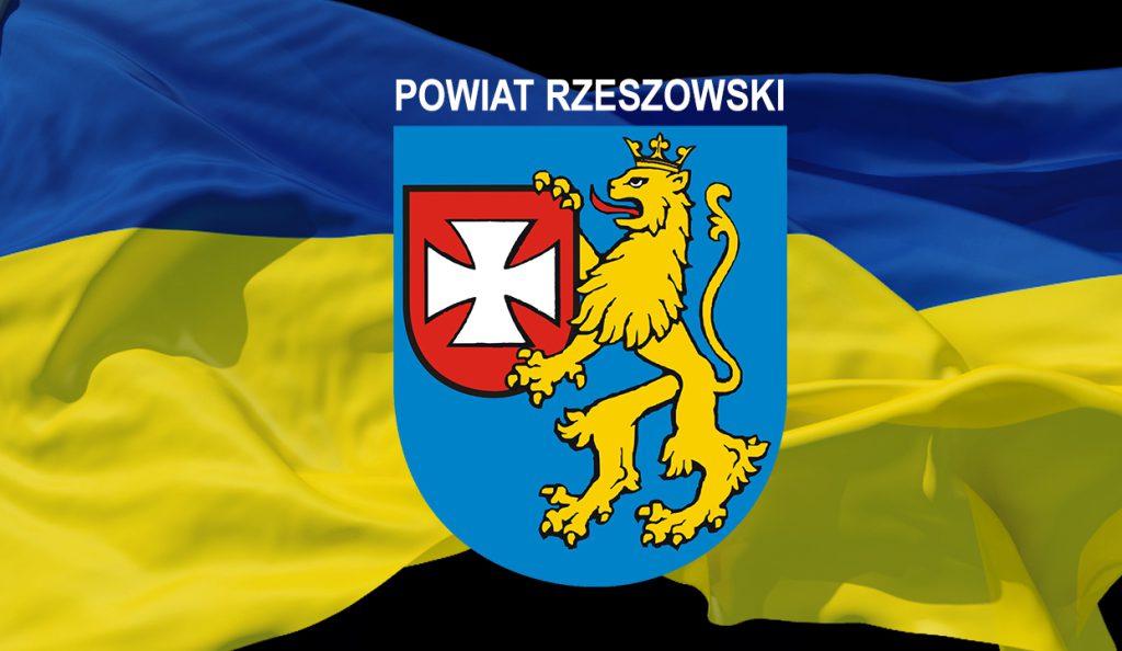 herb powiatu z ukraińską flagą